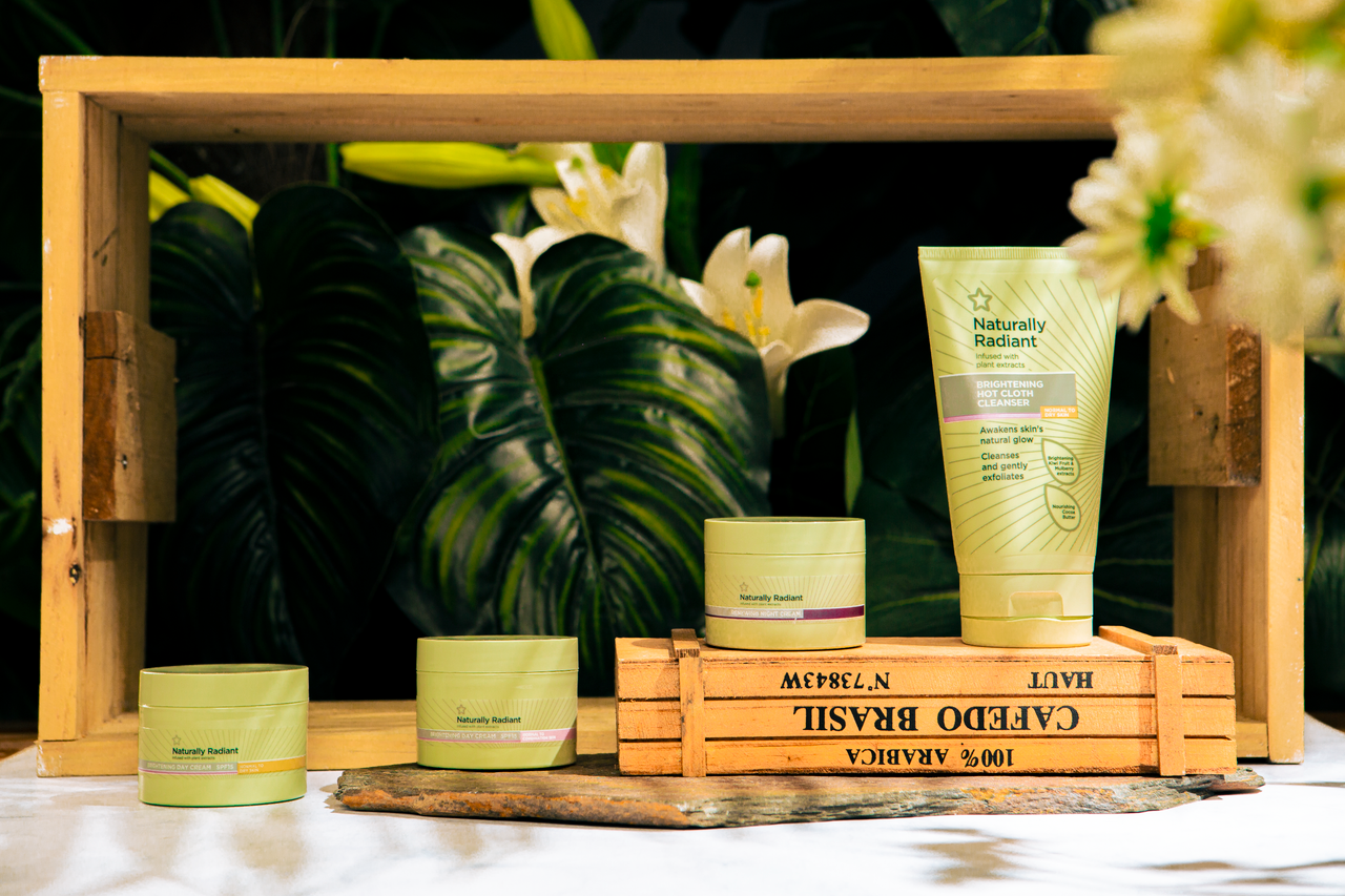 The Art of Drawing Readers In: Your attractive post title goes here Skincare products showcased among lush greenery with a natural radiant theme.